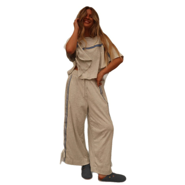 Ladies two-piece leisure ensemble with boxy ruffle top and wide cord pants with side decorative stripe Mune Fashion