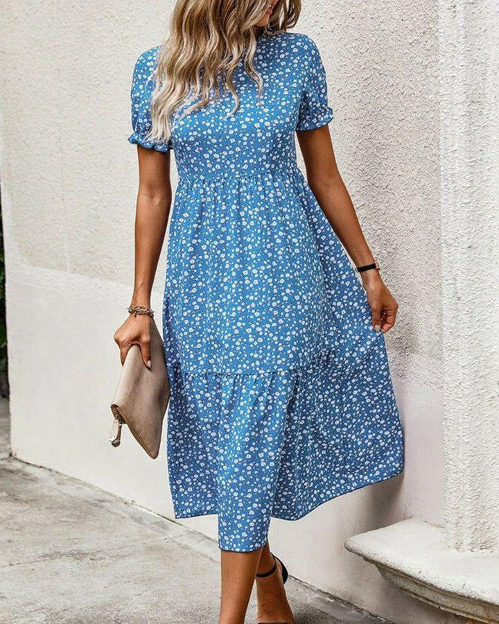 Women's knee-length A-line dress with high round neckline, puff sleeves, gathered empire waist, and tiered hem Mune Fashion