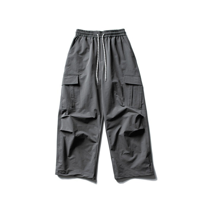 Unisex Wide Cargo Utility Pants in Baggy Cut with Elastic Drawstring Waist and Generous Flap Pockets