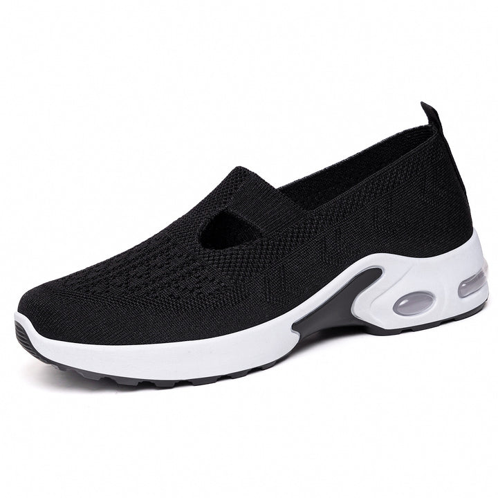 Women’s knitted slip-on sports slipper with elastic entry, cut-out detail, and visible air cushioning Mune Fashion