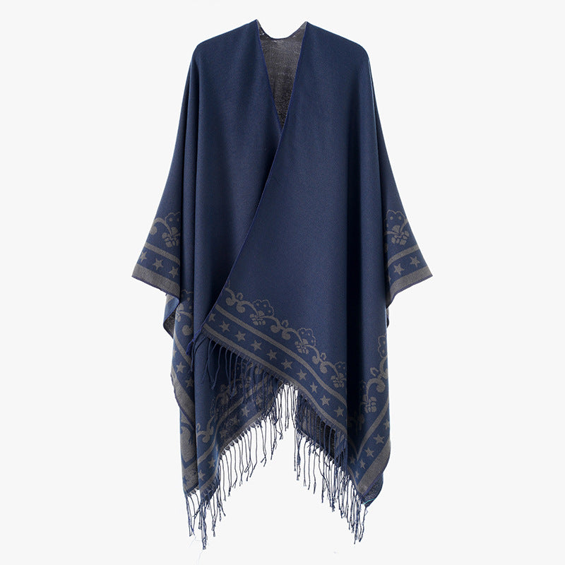 Women's poncho wrap made of wool blend with subtle jacquard border pattern and fringed hem Mune Fashion