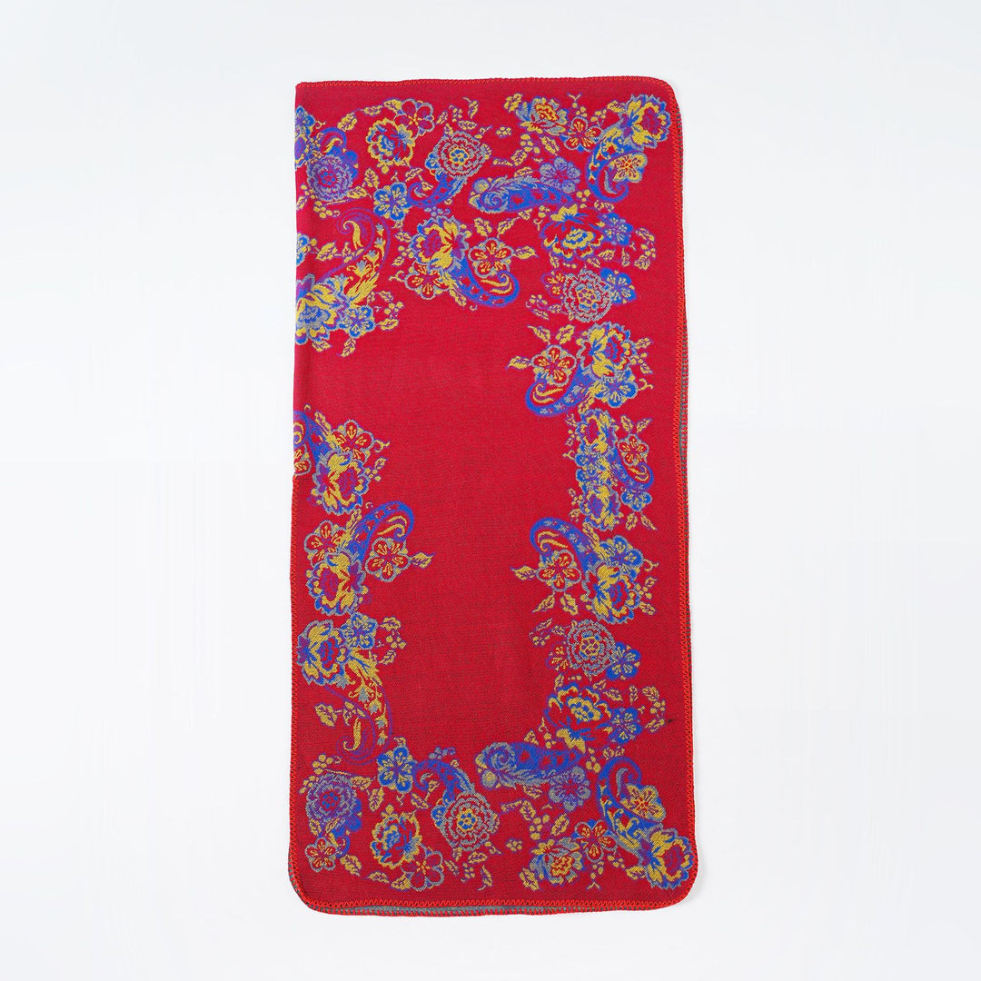 Women's jacquard poncho made of wool blend with floral pattern and overlock edge