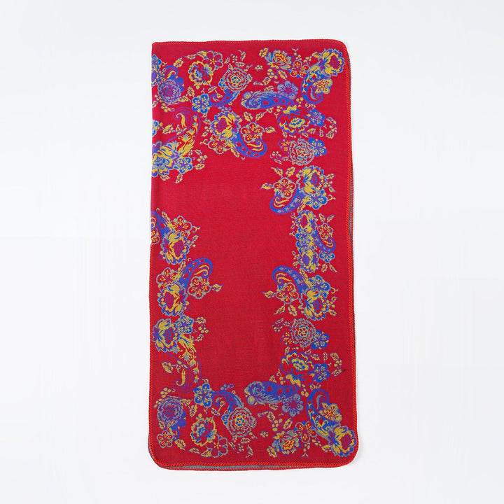 Women's jacquard poncho made of wool blend with floral pattern and overlock edge