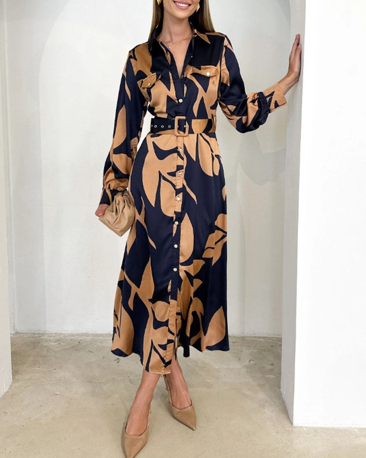Ladies' elegant satin shirt dress with waist belt, chest pockets, and abstract leaf print Mune Fashion