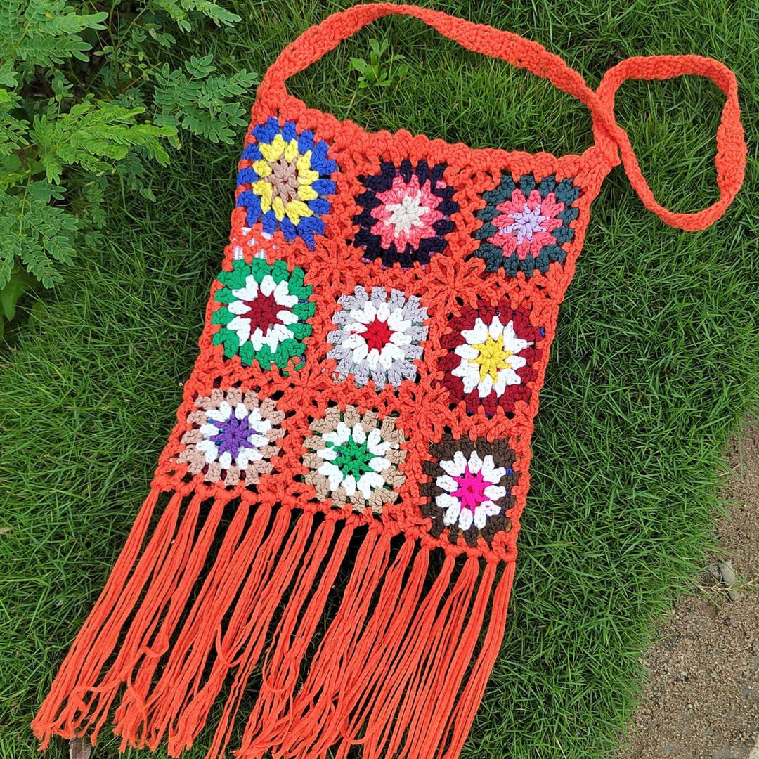 Women crocheted shoulder bag with colorful floral patterns and fringes Mune Fashion