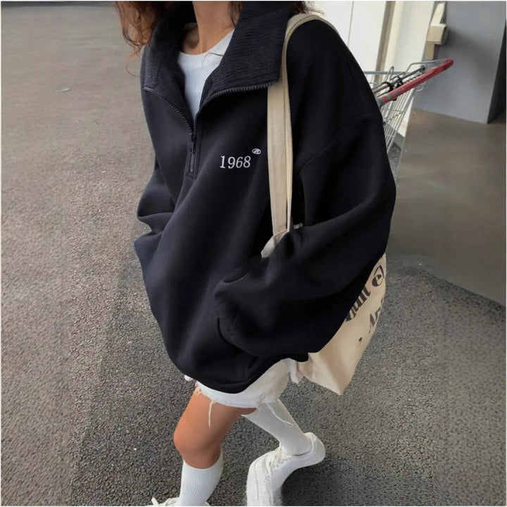Women's oversized half-zip sweatshirt with high collar, kangaroo pocket, and casual oversized fit Mune Fashion