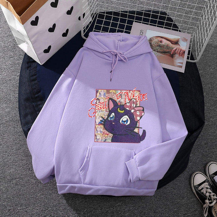 Women's oversized hoodie with shimmering anime cat motif, kangaroo pocket, and soft fleece lining Mune Fashion