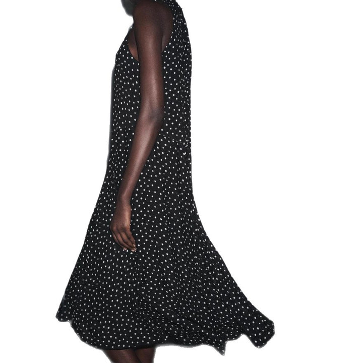 Women’s sleeveless high-neck midi dress with swinging flounce skirt and feminine A-line Mune Fashion