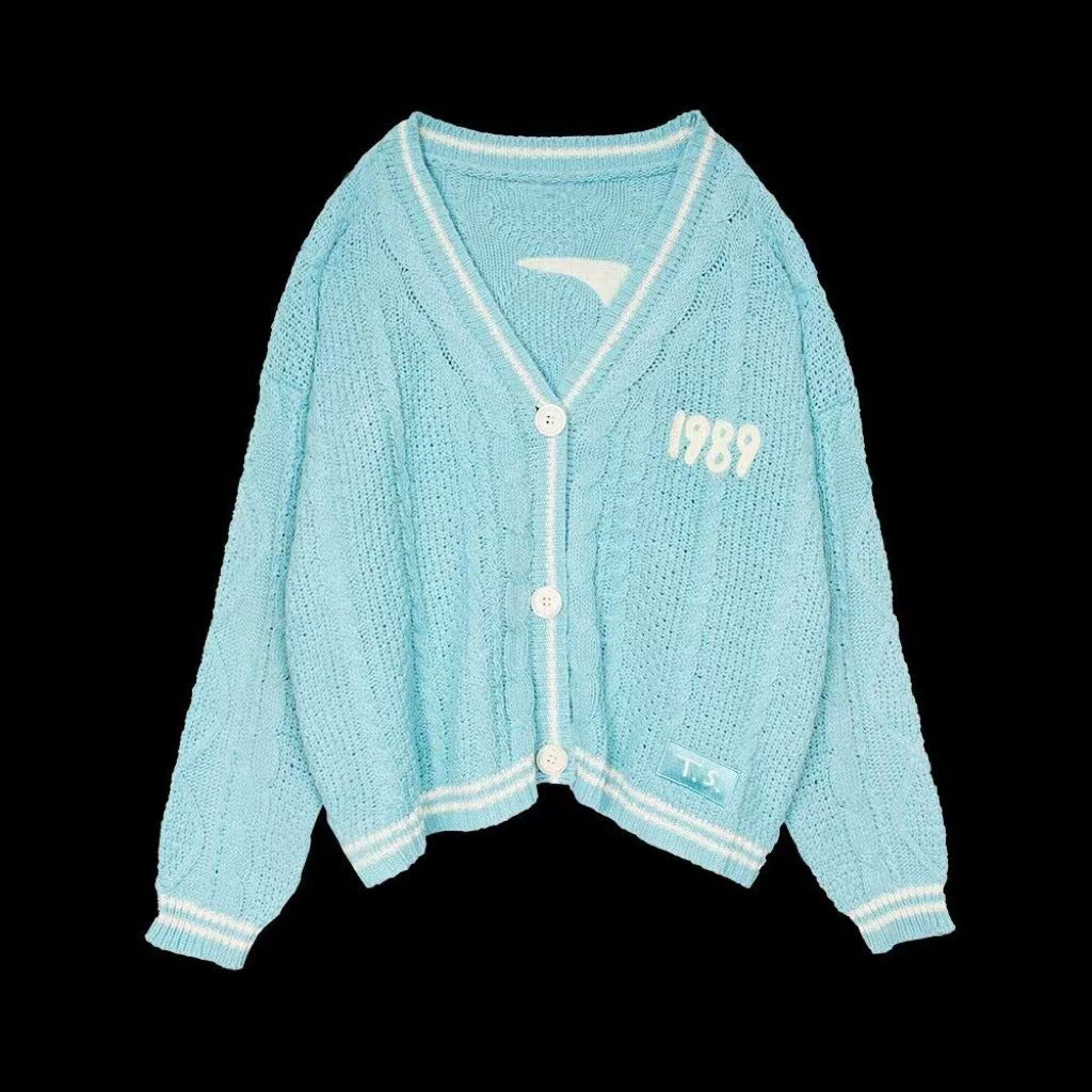 Women’s cropped cardigan with V-neck, contrast piping and oversized sleeves Mune Fashion