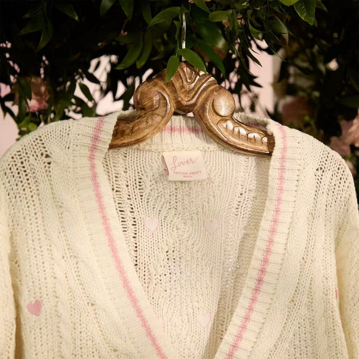 Women’s chunky knitted V-neck cardigan with heart appliqués and decorative heart buttons Mune Fashion