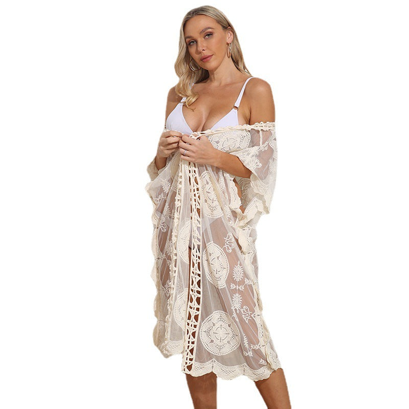Women crocheted beach cover-up with floral appliqués Mune Fashion