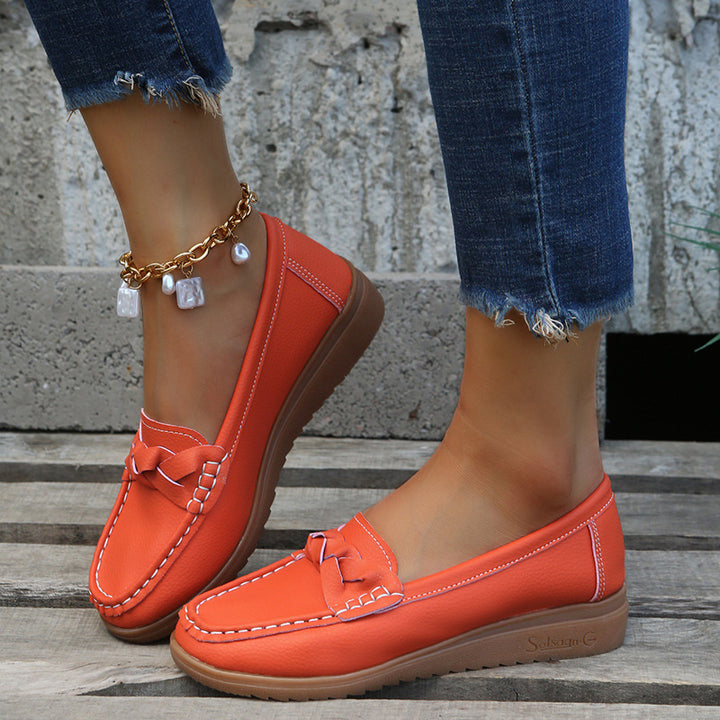 Ladies braided comfort moccasin with contrast stitching, padded memory insole, and flexible rubber profile Mune Fashion