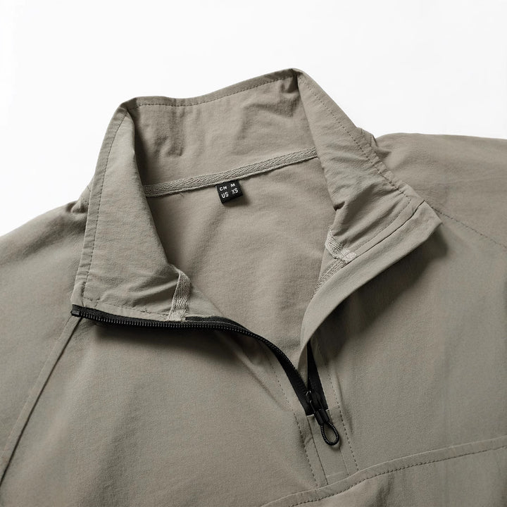 Men's tactical half-zip outdoor pullover with high standing collar, concealed zipper, and arm pockets Mune Fashion