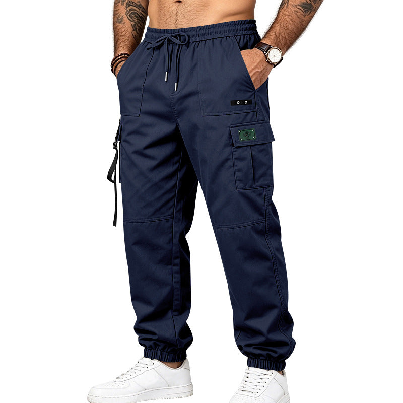 Men's utility cargo pants in jogger style with elastic waistband, multiple pockets and leg straps Mune Fashion