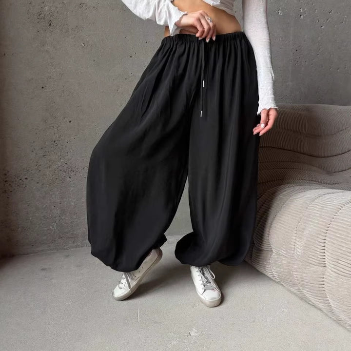 Women's wide harem balloon pants with high elastic waistband, drawstring, and casual wide fit.