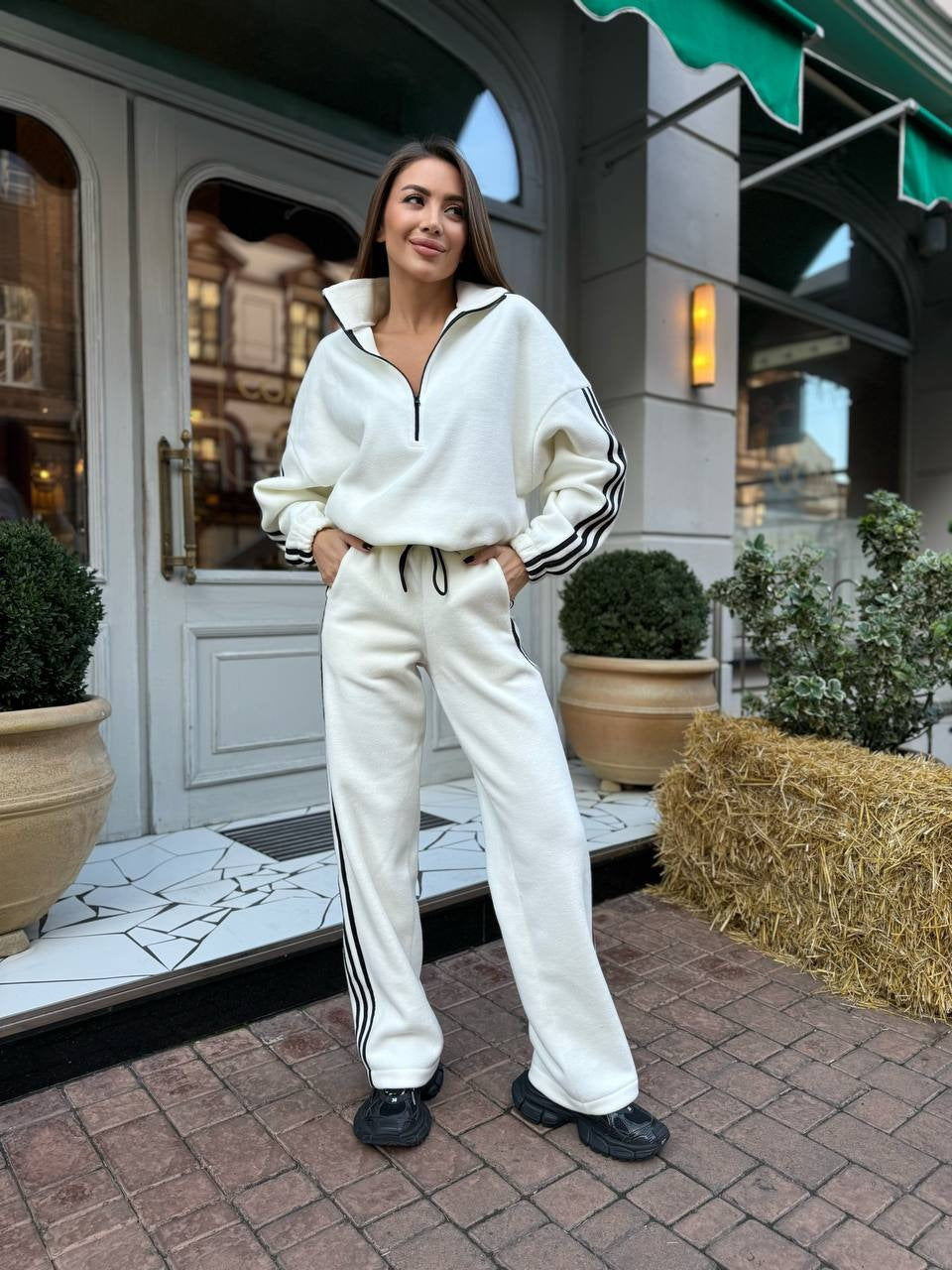 Women's casual high neck half zip tracksuit with distinctive side stripes, oversized hood and loose jogger pants Mune Fashion