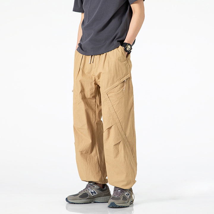 Men's loose-fitting nylon cargo pants with drawstring waistband and angled utility pockets Mune Fashion