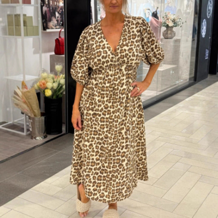 Women's maxi dress with deep V-neck, voluminous puff sleeves, and smocked waist seam Mune Fashion