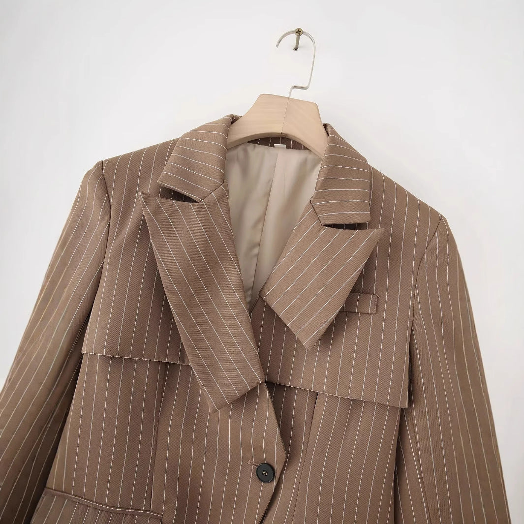 Women's striped oversized blazer with asymmetrical shawl collar overlay and flap pockets Mune Fashion