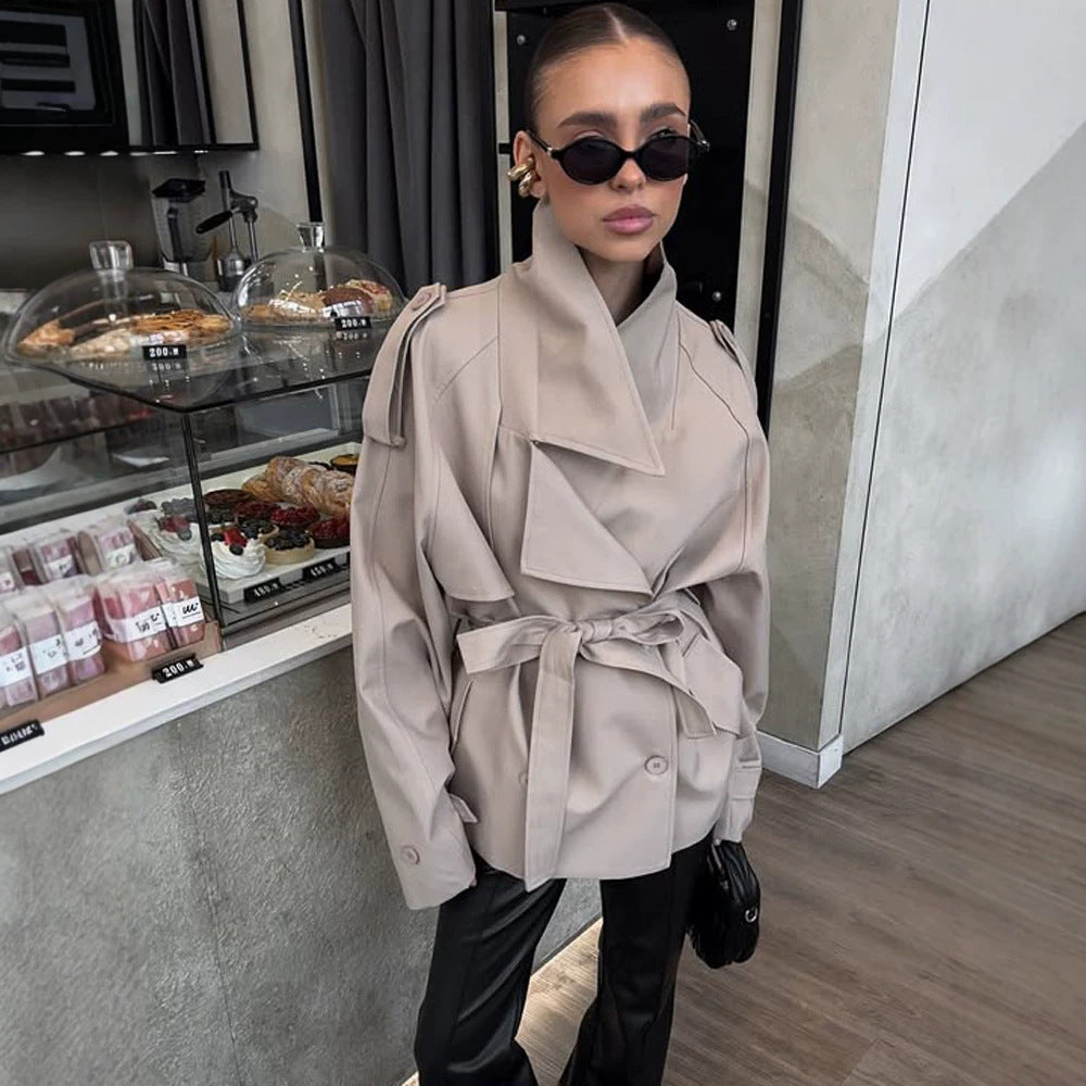 Women's short trench coat with wide standing collar, shoulder epaulettes, and waist belt Mune Fashion