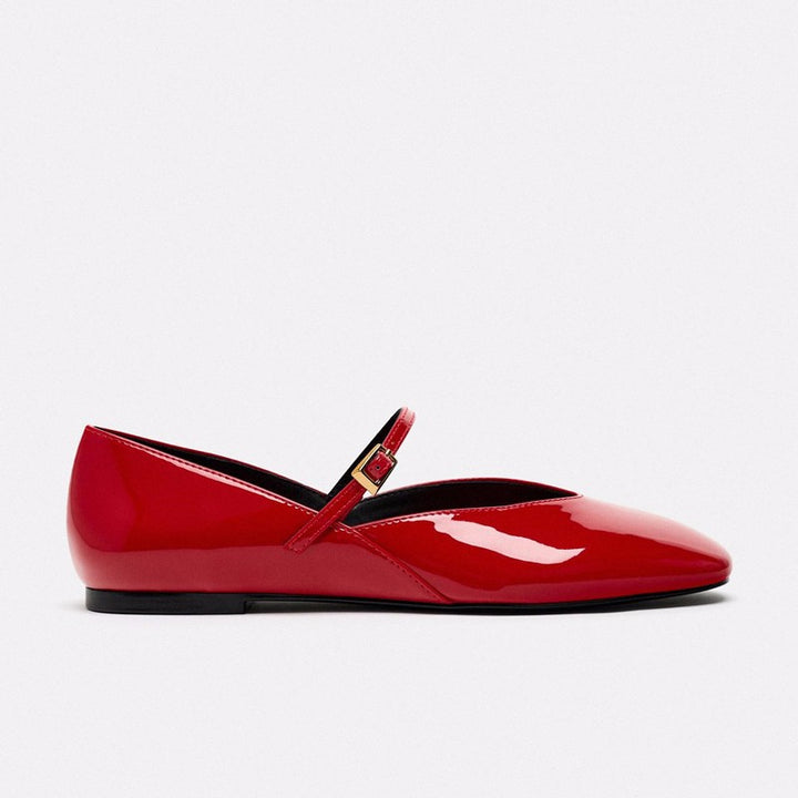 Women's elegant patent leather Mary Jane ballerina flats with a fine metal buckle and pointed toe cap.
