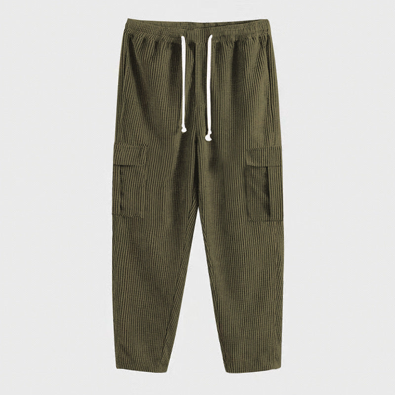 Men's corduroy cargo jogging pants with elastic drawstring waistband, flap pockets, and tapered leg Mune Fashion