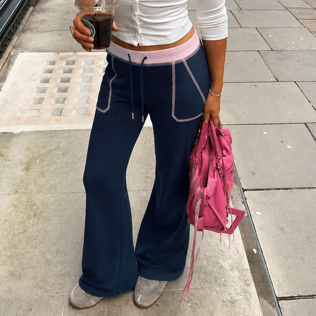 Women nan flared sweatpants with high waistband, drawstring, and contrasting decorative seams Mune Fashion
