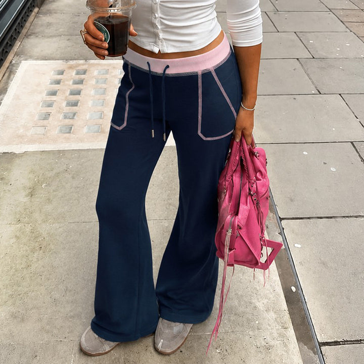 Women nan flared sweatpants with high waistband, drawstring, and contrasting decorative seams Mune Fashion
