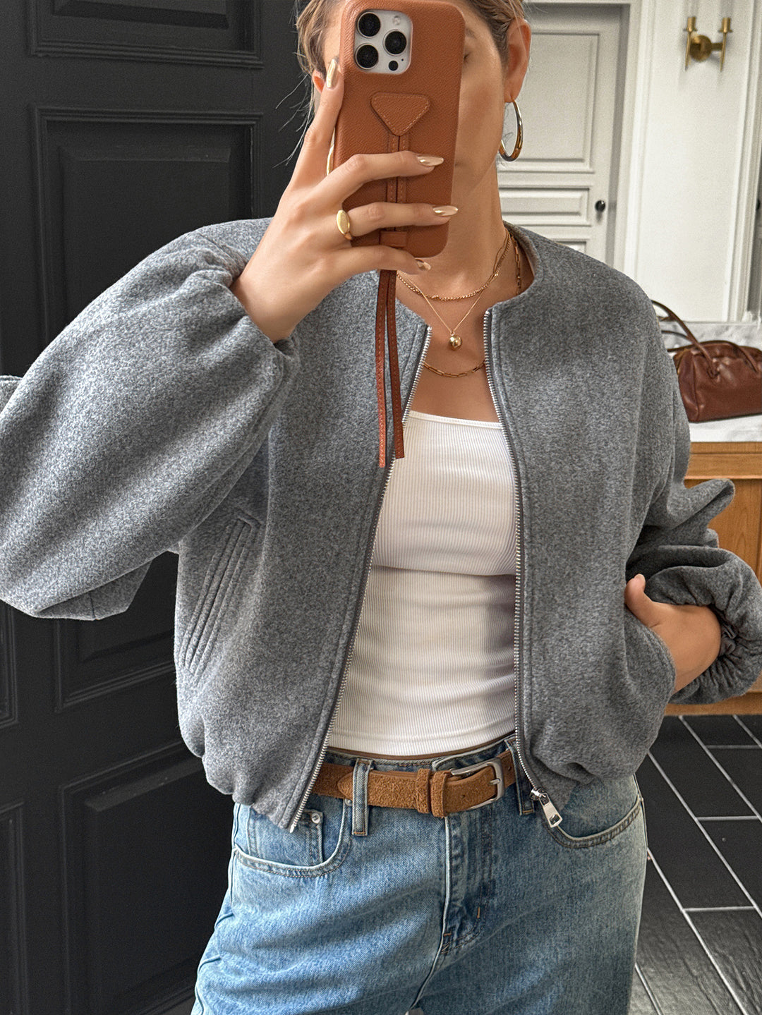 Women's short cozy bomber jacket with continuous zipper, elastic hem, and concealed pockets Mune Fashion
