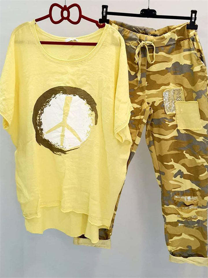 Women’s casual leisure two-piece with wide-cut linen look shirt, peace symbol and camouflage jog pants with patch details Mune Fashion