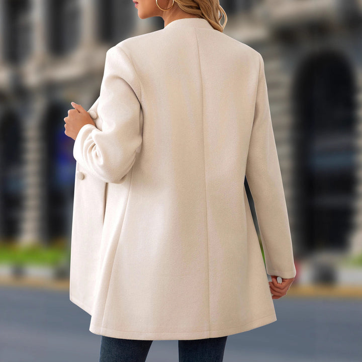 Ladies short coat with stand-up collar, fitted A-line and concealed fabric buttons Drune