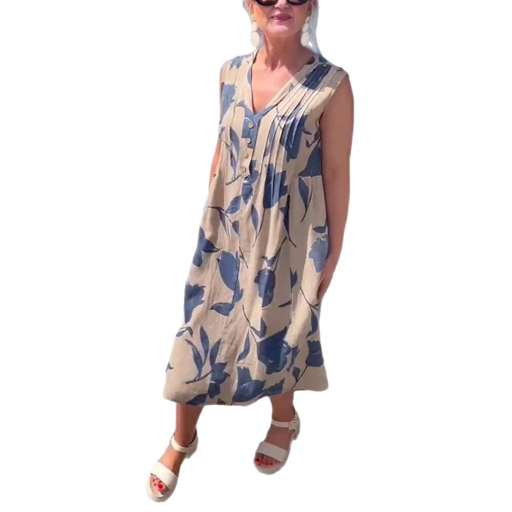 Women's sleeveless A-line midi dress with V-neck, bust pleats, button placket, and large floral print Mune Fashion