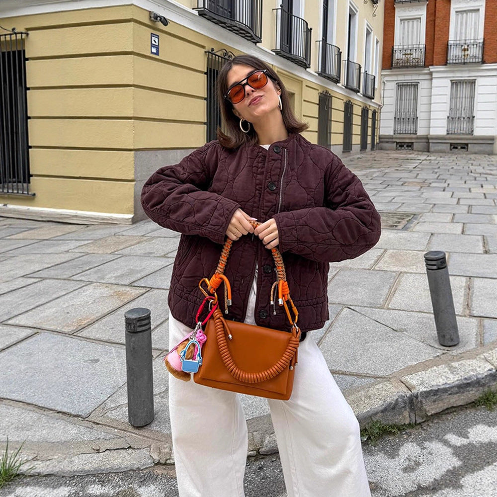 Women's shoulder bag made of synthetic leather with braided handle and spiral-shaped front grip Mune Fashion