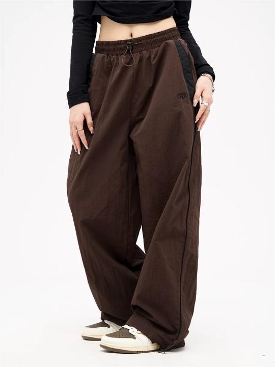 Women's wide track pants with contrast piping, elastic waistband and oversized fit Mune Fashion