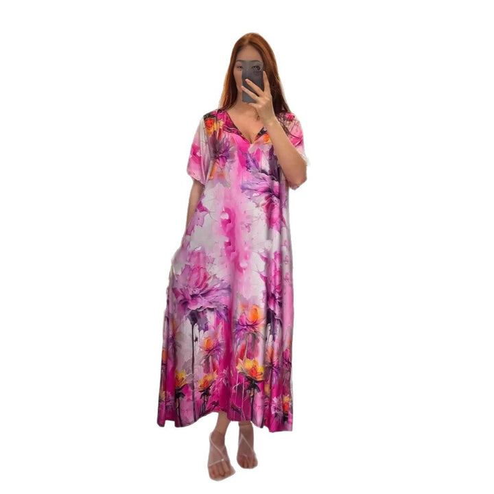 Women flowing maxi kaftan dress with V-neck and large watercolor floral print Mune Fashion