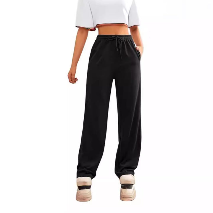 Women's flowing Relax palazzo pants with high comfort waistband, drawstring and side slip pockets Mune Fashion