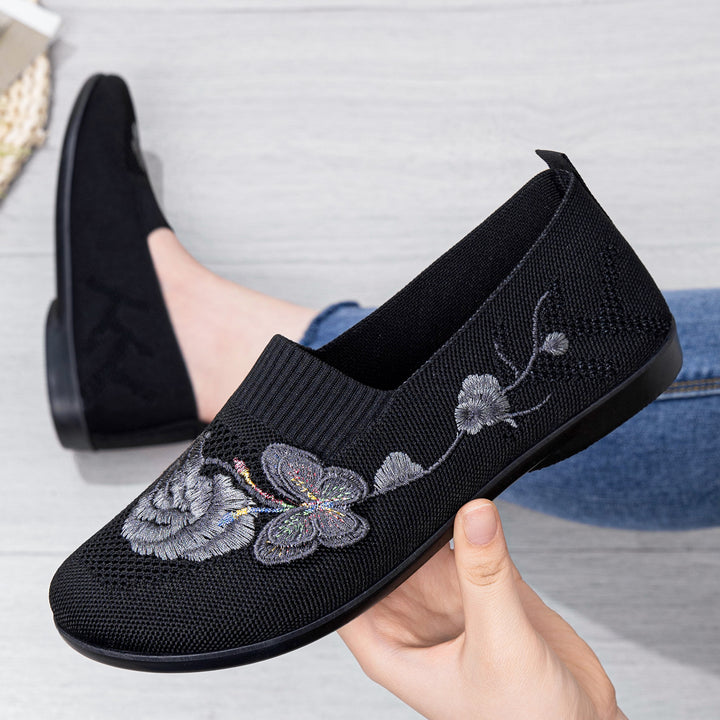 Women's embroidered knitted slipper with sock-like entry, floral embroidery design, and cushioned lightweight sole Mune Fashion