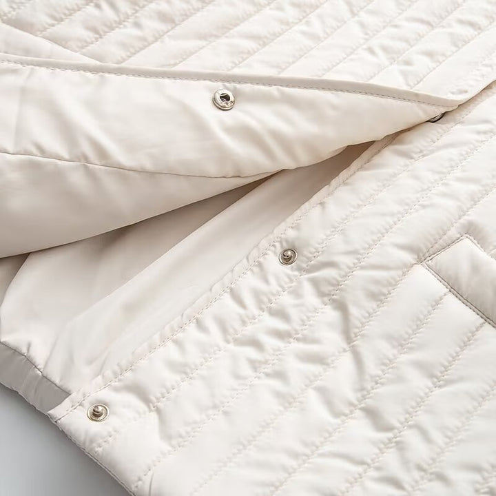 Women's short quilted jacket with vertical quilting, shirt collar and heart button placket Mune Fashion