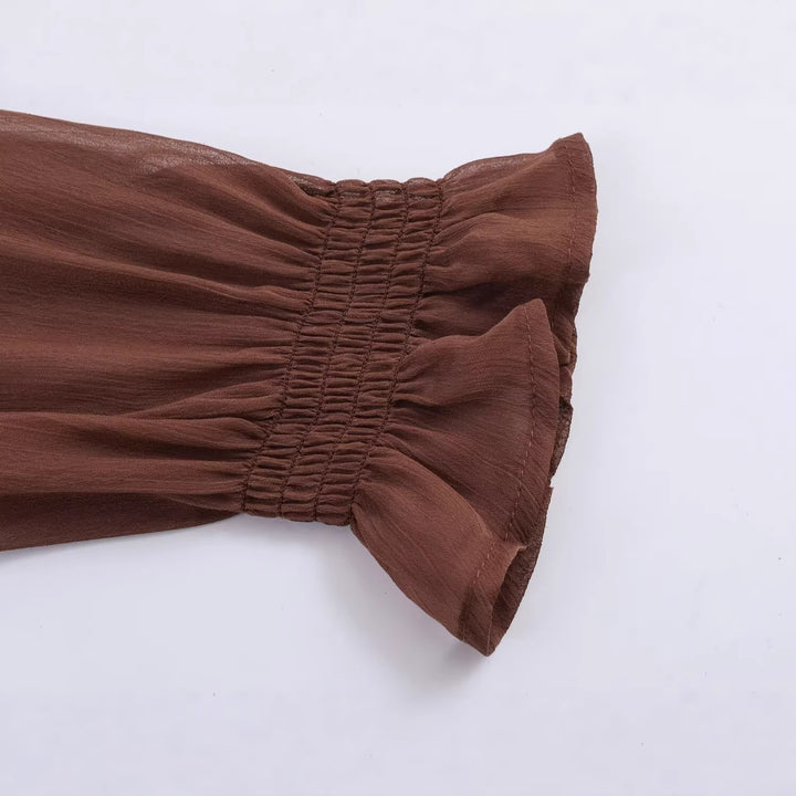 Women's chiffon blouse with smocked bodice, voluminous balloon sleeves, and ruffled collar Mune Fashion