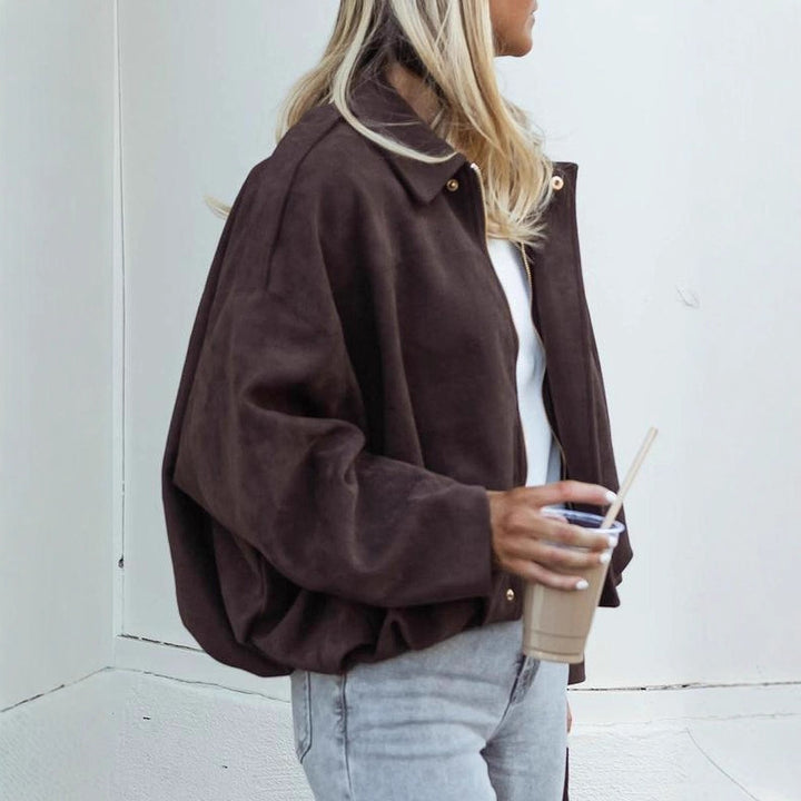 Women's short-cut bomber jacket in suede look with dropped shoulders, epaulettes, and elastic hem Mune Fashion