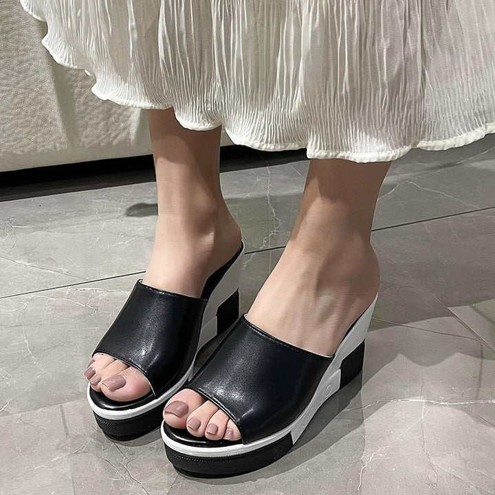 Women's slip-on sandals made of synthetic leather finish with open toe area, ergonomic wedge heel, and padded comfort footbed Mune Fashion