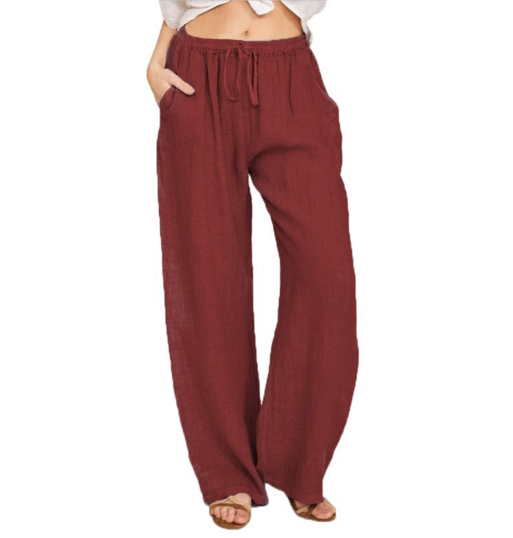 Women's airy palazzo pants with drawstring waistband, elastic waist finish, and side pockets Mune Fashion