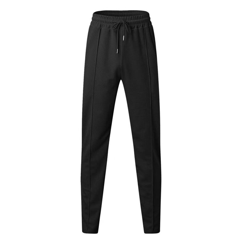 Men's patterned jogging pants with elastic drawstring, shaping crease, and tapered leg Mune Fashion