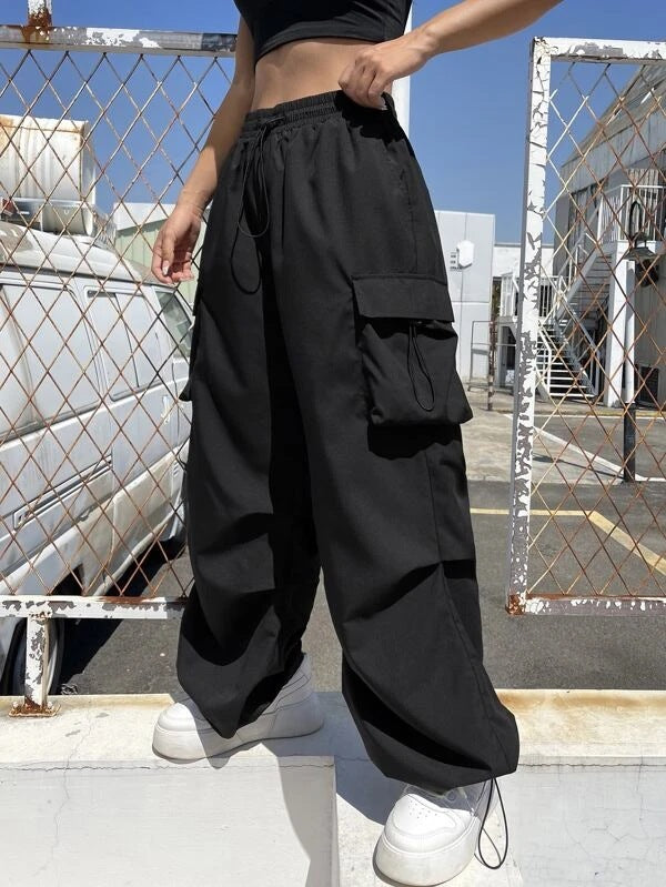 Women’s wide cargo pants with drawstring waist, multiple pockets, and adjustable hem Mune Fashion