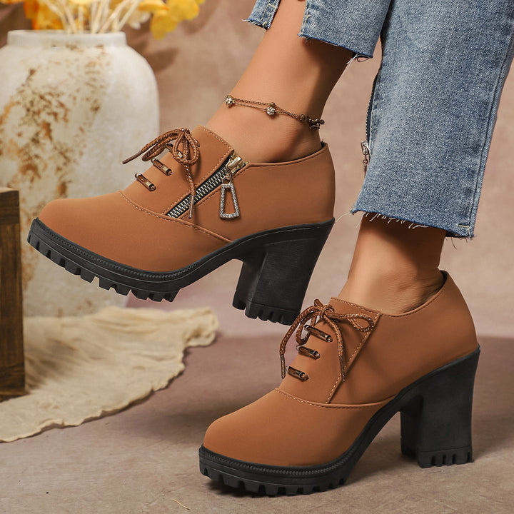 Women's elegant lace-up booties with sturdy block heel, side zipper, and decorative pendant Mune Fashion