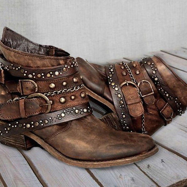 Women ankle-high biker ankle boots with multiple studded straps, decorative chains, and adjustable buckles Mune Fashion