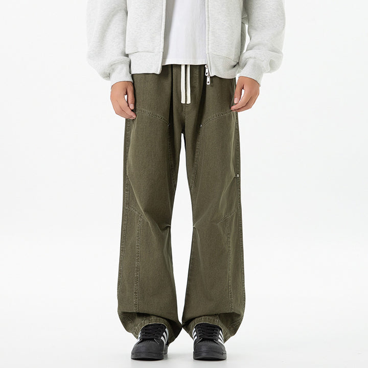 Men's wide baggy cargo pants made of washed canvas with elastic waistband and decorative stitching panels Drune