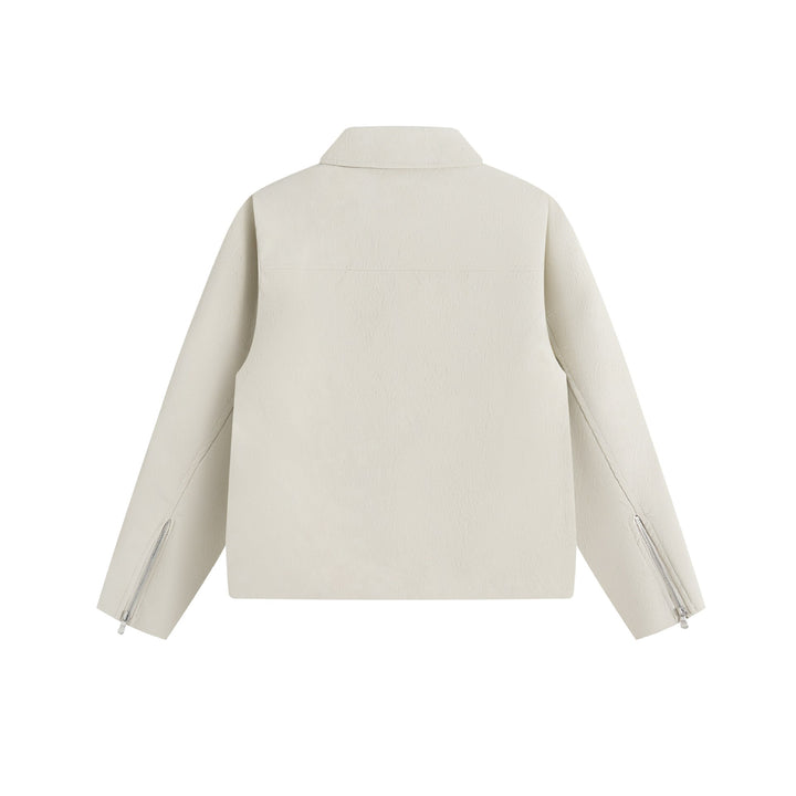 Men's short jacket in suede look with asymmetric front flap and geometric flap pockets.