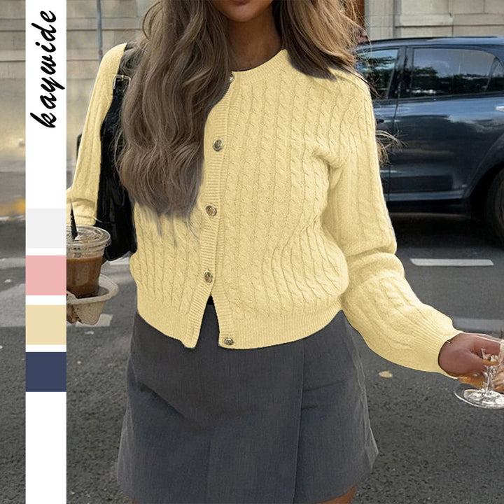 Women’s cropped cable knit cardigan with decorative medallion buttons and round neckline Mune Fashion