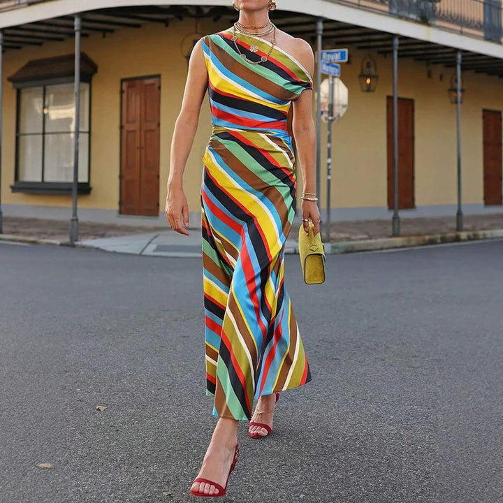 Women's asymmetrical off-shoulder maxi dress with diagonal stripe pattern and fitted silhouette Mune Fashion